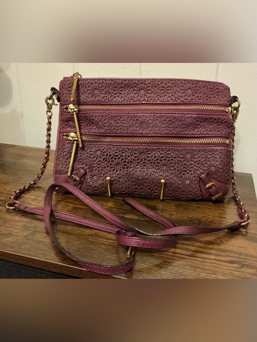 a Vintage Rare Elliott Lucca burgundy Leather laser-cut leather crossbody bag